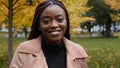 Female portrait close-up young serious pensive beautiful stylish african american woman standing outdoors looking at Royalty Free Stock Photo