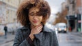 Female portrait young sad curly african american girl woman feeling sore throat discomfort coughing suffering from flu Royalty Free Stock Photo