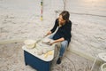 Female Potter creating bowl on Potters wheel