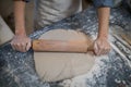 Female potter flattening the clay with rolling pin Royalty Free Stock Photo