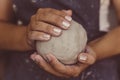 Female potter hands holds clay for pottery, selective focus Royalty Free Stock Photo