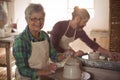 Female potter making a pot