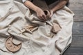 Female potter shaping piece of clay at the table. Woman making ceramic item. Pottery working, handmade and creative