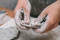 Female potter works with clay, craftsman hands close up Royalty Free Stock Photo