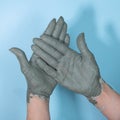 Female potter works with clay, craftsman hands close up, kneads and moistens the clay before work. Royalty Free Stock Photo