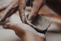 Female potter works with clay, craftsman hands close up