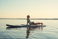 Female practicing yoga on a SUP board Royalty Free Stock Photo