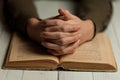 Female praying hands on an open bible Royalty Free Stock Photo