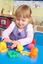 Female Pre School Pupil Playing With Modelling Clay Royalty Free Stock Photo