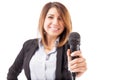 Female presenter handing over the microphone