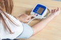 Female press start button on blood pressure