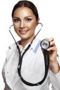 Female pretty doctor with a stethoscope listening Royalty Free Stock Photo