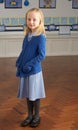 Female Primary School Pupil Standing In Classroom