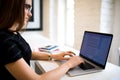 Woman in glasses skilled freelance social media content writer keyboarding on laptop computer.