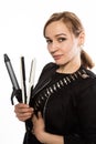 Female professional hairdresser with ploy. Elegant woman presents her hairdresser`s accessories. Hair styling and beauty concept