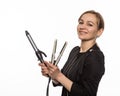 Female professional hairdresser with ploy. Elegant woman presents her hairdresser`s accessories. Hair styling and beauty
