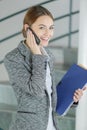 Female professional talking on cellular phone Royalty Free Stock Photo