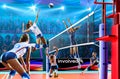 Female professional volleyball players in action on grand court Royalty Free Stock Photo