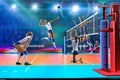 Female professional volleyball players in action on grand court Royalty Free Stock Photo