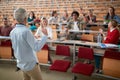 Female professor lecturing the students Royalty Free Stock Photo