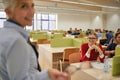 A female professor and students at the lecture in an educational institution. Smart young people study at the college. Education,