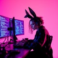 Female Programmer Coding on Computer with Cyberpunk Neon Lighting Royalty Free Stock Photo