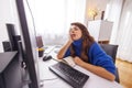 Female programmer sleeping at her desk tired while working overtime Royalty Free Stock Photo