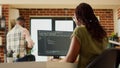 Female programmer using code to develop online app Royalty Free Stock Photo