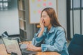 Female programmers are sleepy and exhausted after working and planning to work on programming, software coding and web design.