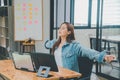 Female programmers are stretching oneself and relaxing after working and planning to work on programming, software coding and web
