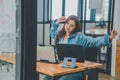 Female programmers are stretching oneself and relaxing after working and planning to work on programming, software coding and web