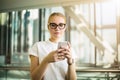 Female prosperous leadership reading news on cellphone Royalty Free Stock Photo