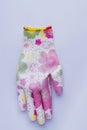 Female protective colorful garden glove.