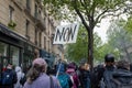 Female protester carrying a sign with the single French word \'Non\', Paris, france
