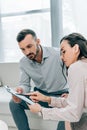 female psychiatrist talking with patient and showing clipboard Royalty Free Stock Photo