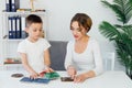 Female psychologist teaching at school in educational games with boy Royalty Free Stock Photo