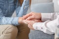 Female psychologyst therapy session with client indoors sitting support close-up