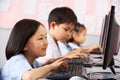 Female Pupil Using Keyboard During Computer Class