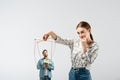 Female puppeteer holding male marionette with Royalty Free Stock Photo