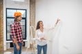 Female purchaser talking to the construction worker Royalty Free Stock Photo