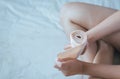 Female putting bandage on his injured hands,Woman using elastic bandage with hand Royalty Free Stock Photo