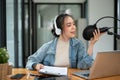 A female radio host sharing interesting news with her online audience during her on-air show