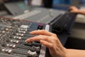Female Radio Host Using Music Mixer In Studio Royalty Free Stock Photo