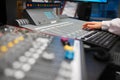 Female Radio Host Using Music Mixer In Studio Royalty Free Stock Photo