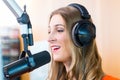 Female radio presenter in radio station on air Royalty Free Stock Photo