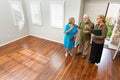 Real Estate Agent Handing New House Keys to Senior Couple Royalty Free Stock Photo