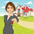 Female real estate agent holding the key of a new house Royalty Free Stock Photo