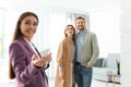 Female real estate agent showing new house to couple Royalty Free Stock Photo