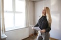 Female Realtor Looking At House Details In Property For Renovation Royalty Free Stock Photo