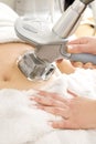 Female receive vacuum treatment at body clinic Royalty Free Stock Photo